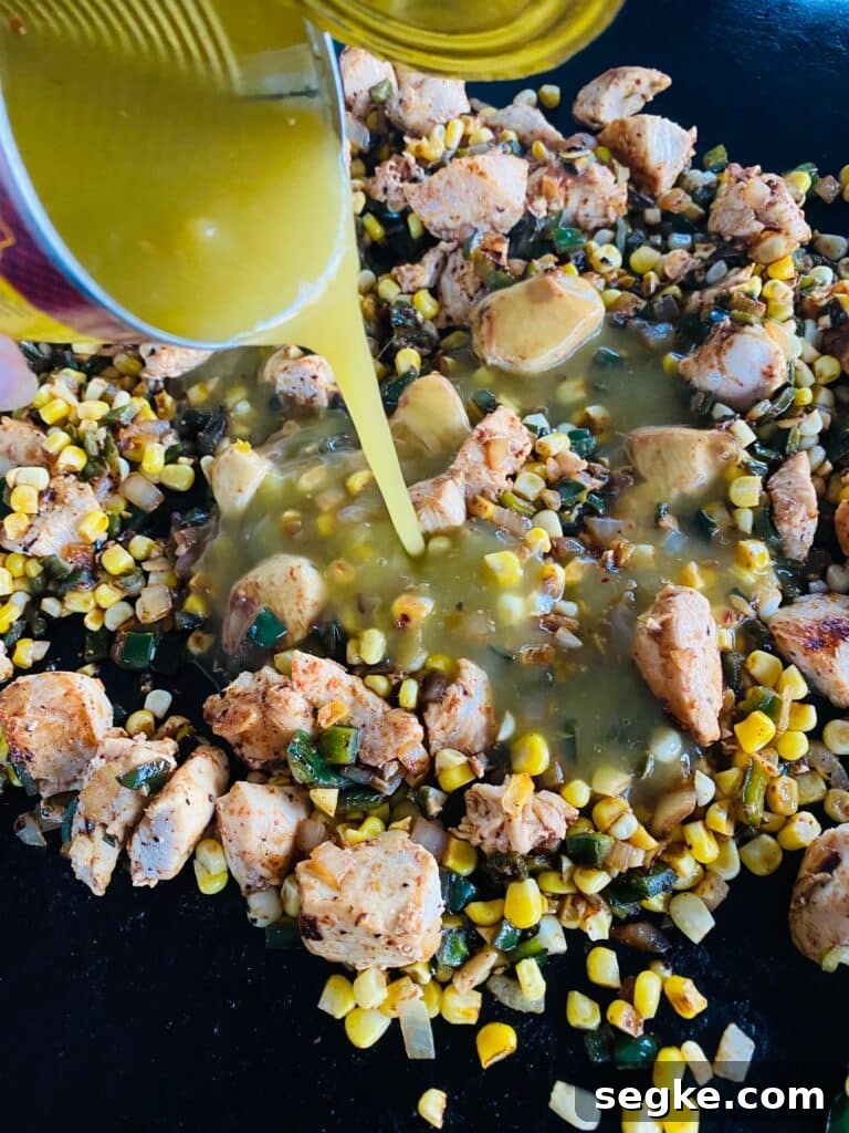 adding the enchilada sauce