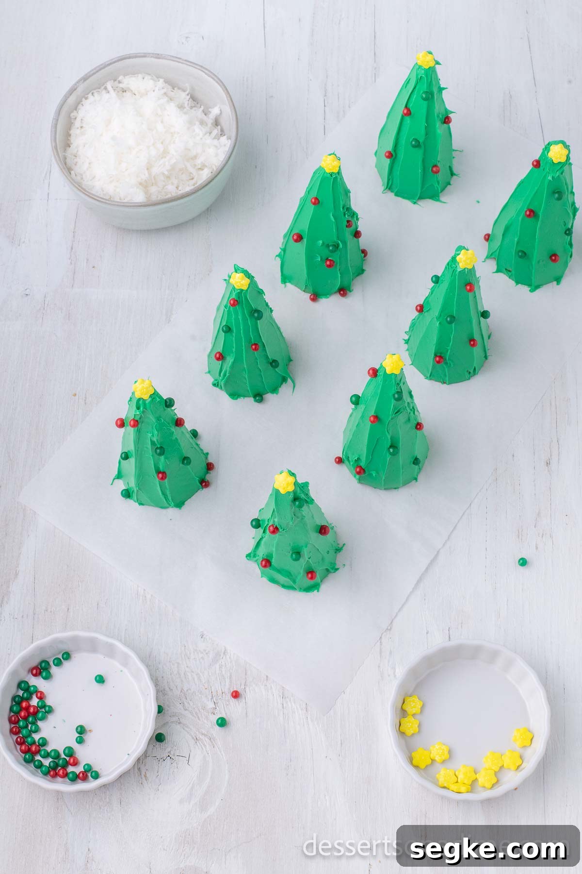 DIY Ice Cream Cone Christmas Tree Ornaments 8 Trees decorated with candy.
