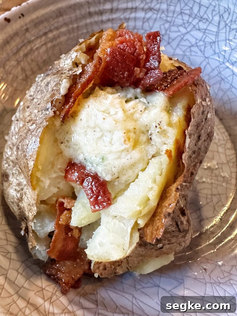 Buttery baked potato with bacon
