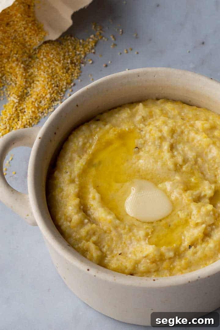 grits in a bowl with melted butter