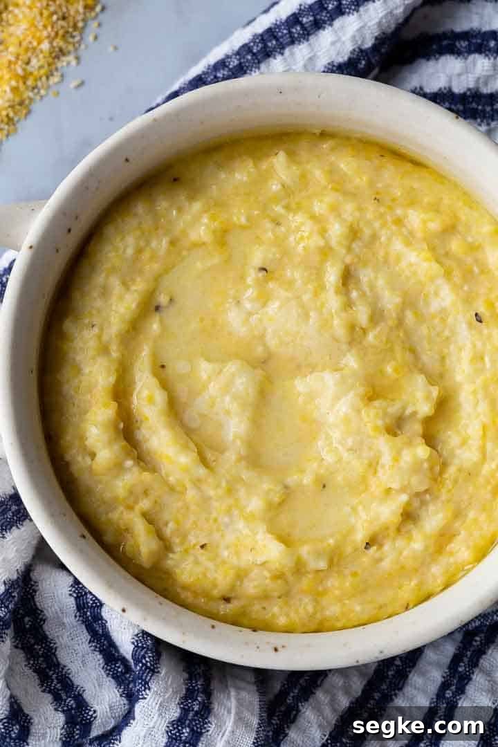 grits in a bowl with a blue and white kitchen towel underneath