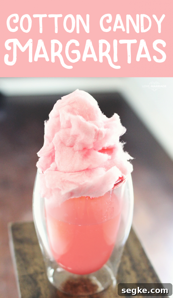 Cotton Candy Margarita | This Cotton Candy Margarita recipe is going to be your new favorite! Yes, there is pink cotton candy inside and it's so good. | Perfect summer cocktail to make with your girlfriends!