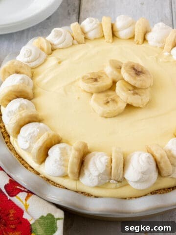 a banana cream pie on a table.