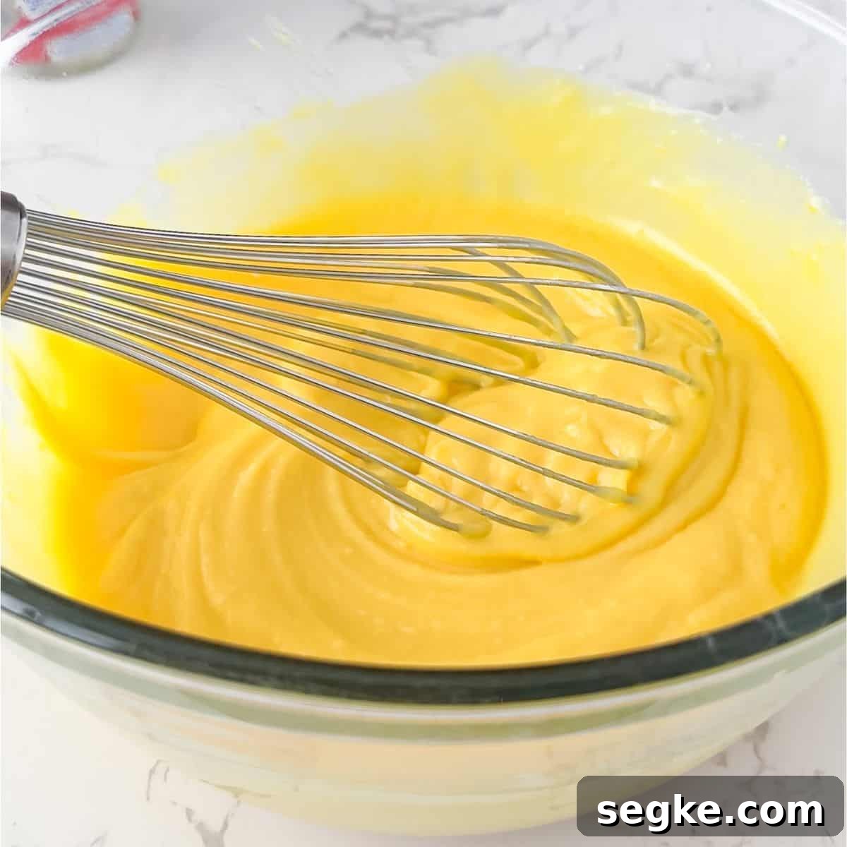 Mixing the milk and pudding.
