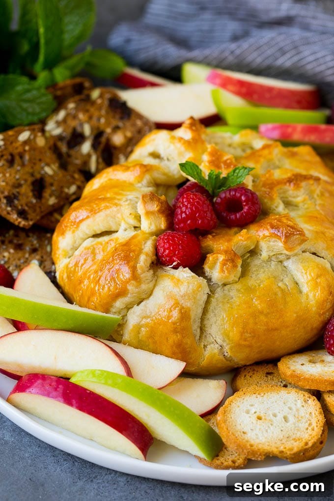 Baked Brie with Raspberries and Toasted Pecans Recipe 4 Brie wrapped in puff pastry, served with apples and crackers.