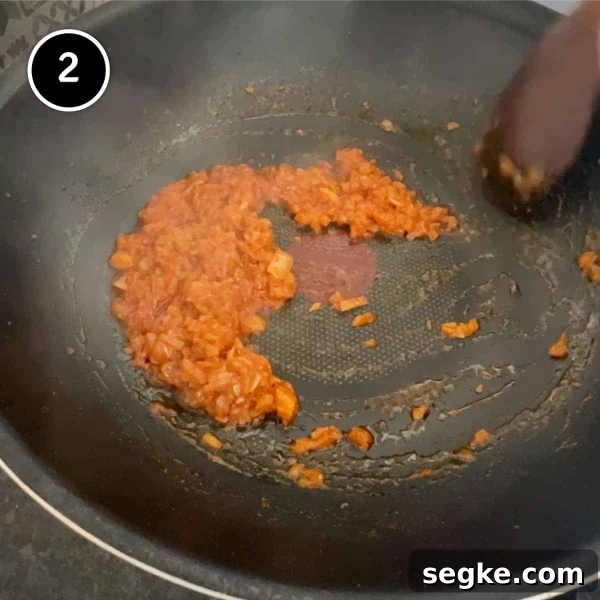 How to Make Authentic Circassian Chicken 3 frying onion, garlic and paprika in a pan