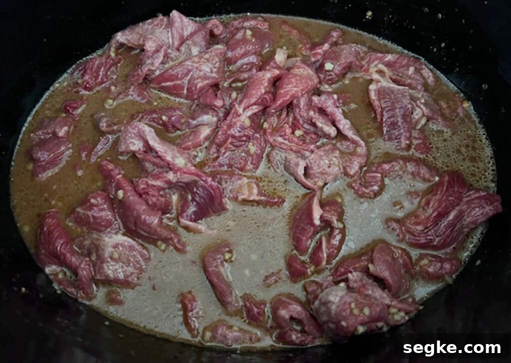 Mongolian beef and sauce before cooking in slow cooker