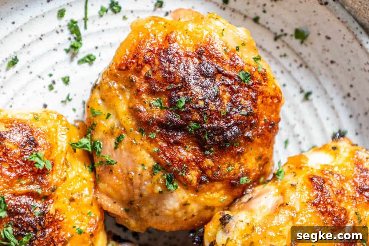 Crispy Oven-Baked Ranch Chicken Thighs 10 Finished baked ranch chicken thighs plated with parsley