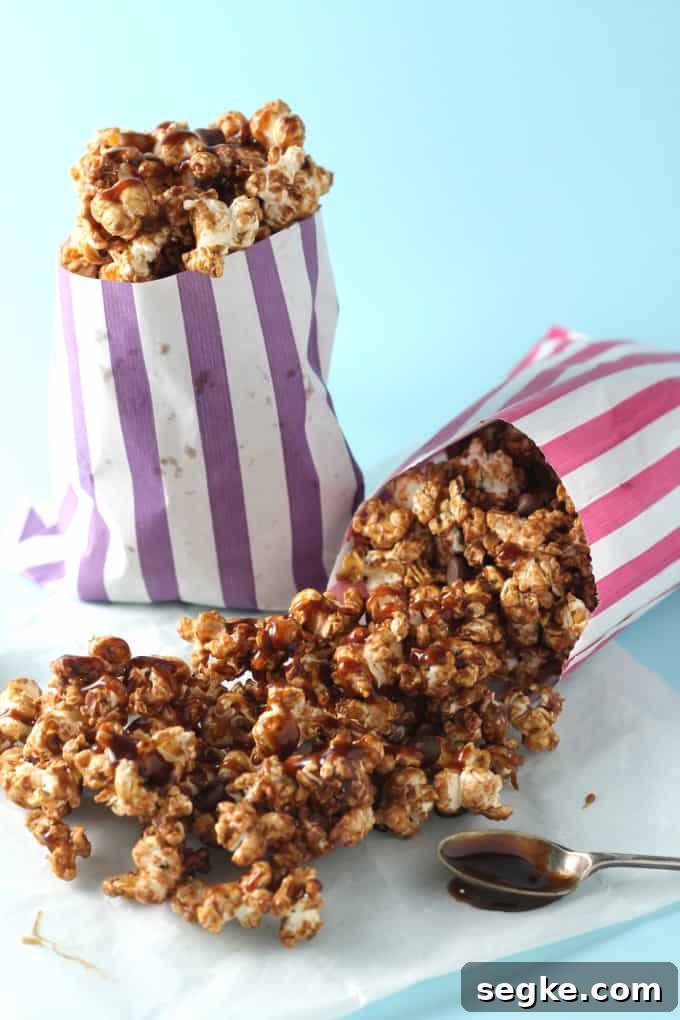 Salted Caramel Chocolate Popcorn Recipe 5 salted caramel chocolate popcorn with the salted caramel sauce drizzled over the top