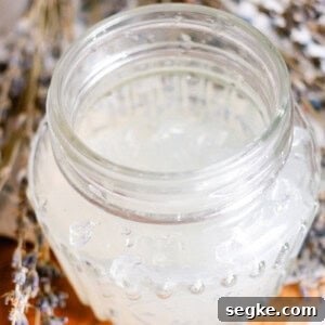 DIY 2-Ingredient Hair Gel You Can Make at Home 10 DIY hair gel made with gelatin in a glass jar with dried lavender sprigs.