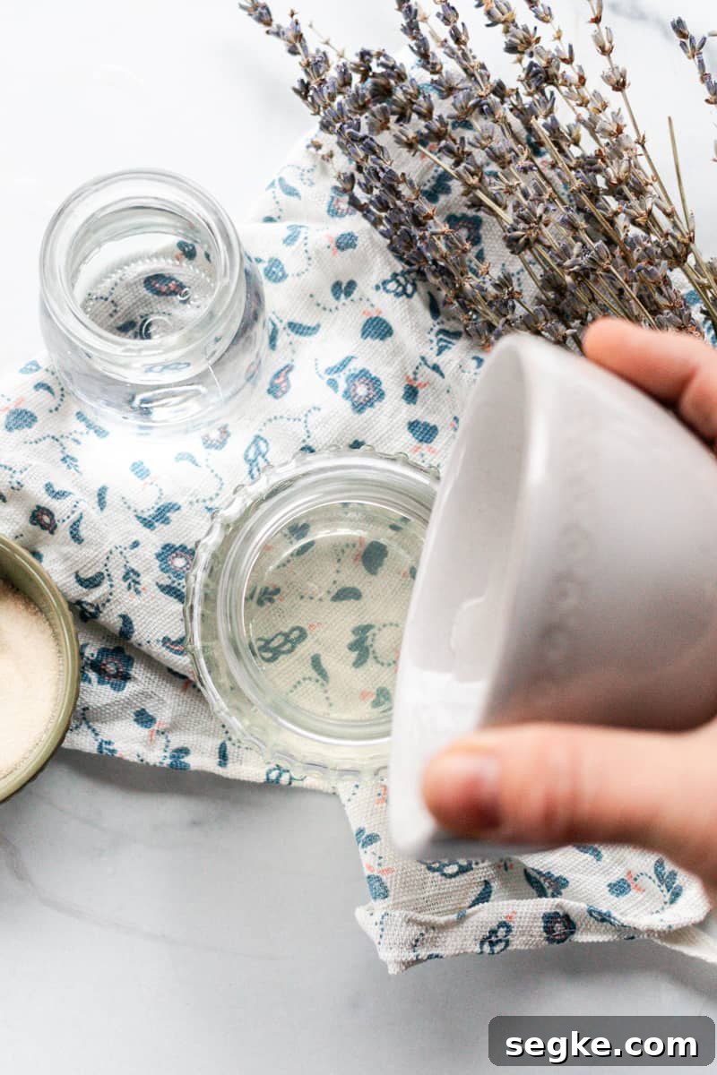 DIY 2-Ingredient Hair Gel You Can Make at Home 9 Pouring the hair gel into an airtight container to allow it to set up.