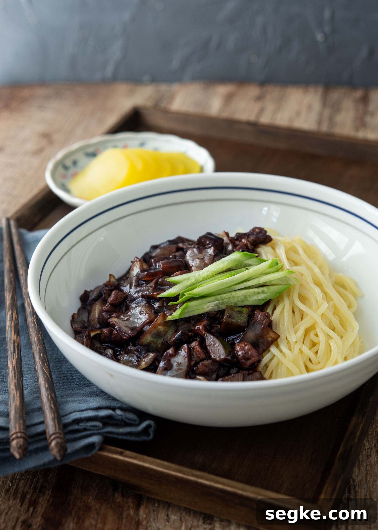 Jajangmyeon Recipe: Korean Black Bean Noodles 8 A bowl of jjajangmyeon topped with cucumber slices.