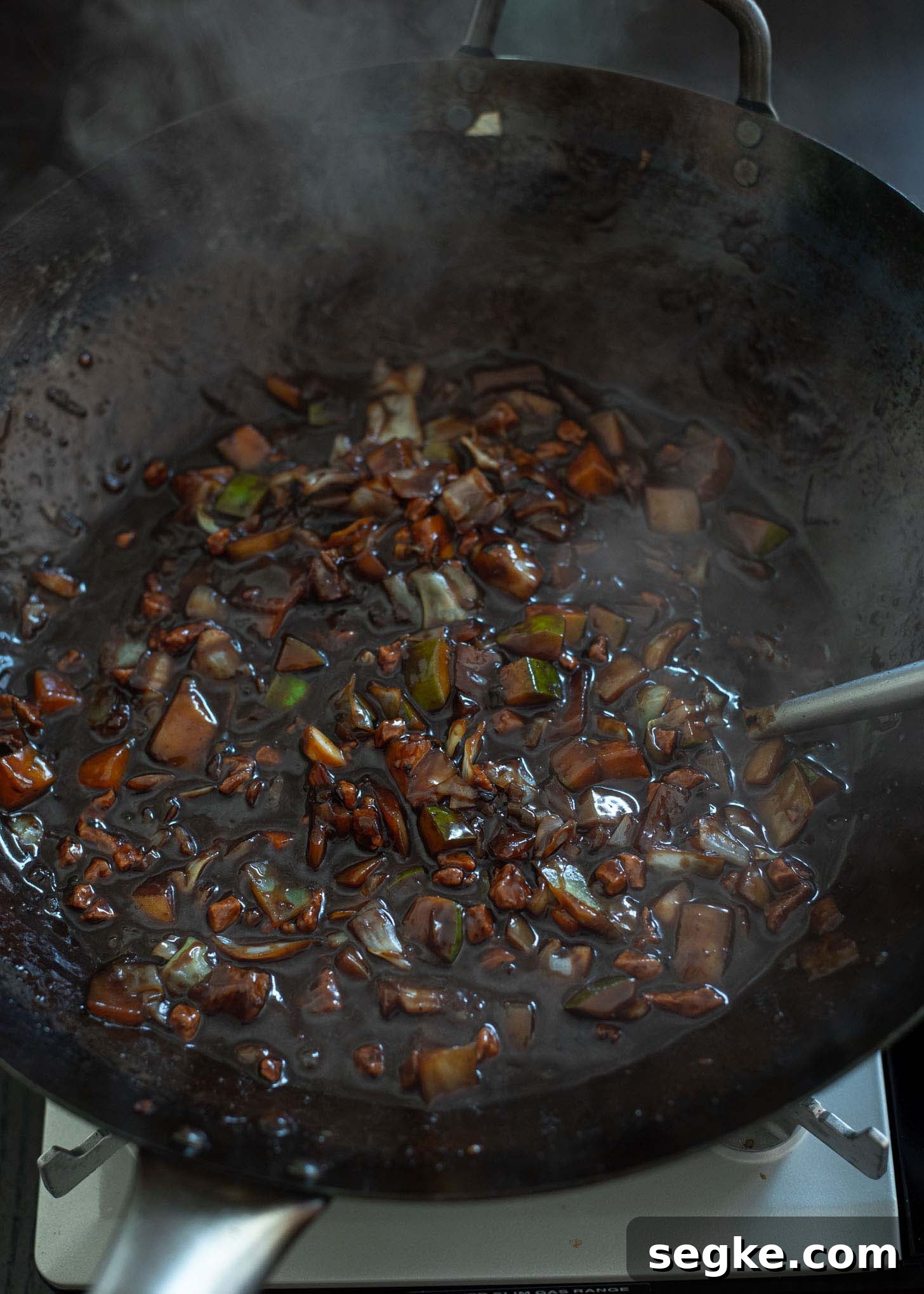Jajangmyeon Recipe: Korean Black Bean Noodles 5 Jajangmyeon sauce simmered in a wok.
