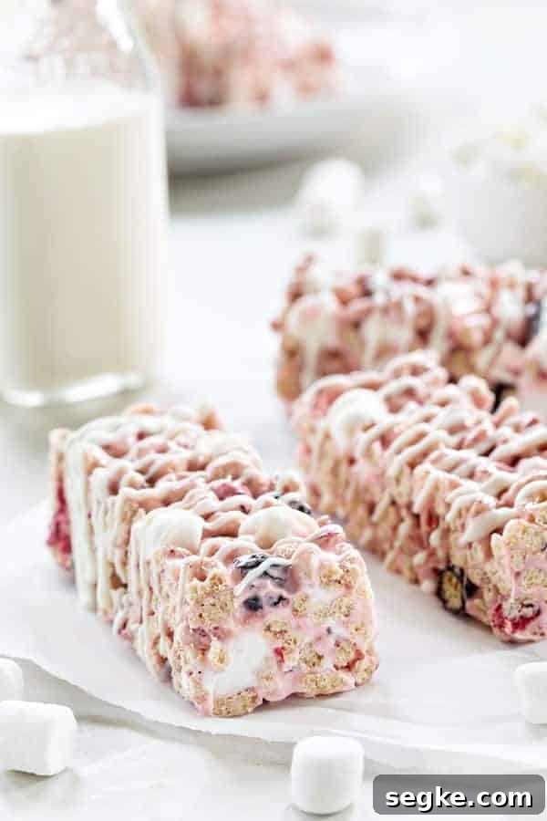 No-Bake Berry Cereal Bars Recipe 2 Berry Cereal Treats are everything you love about marshmallow cereal treats, but with a berry twist. So fun and delicious!
