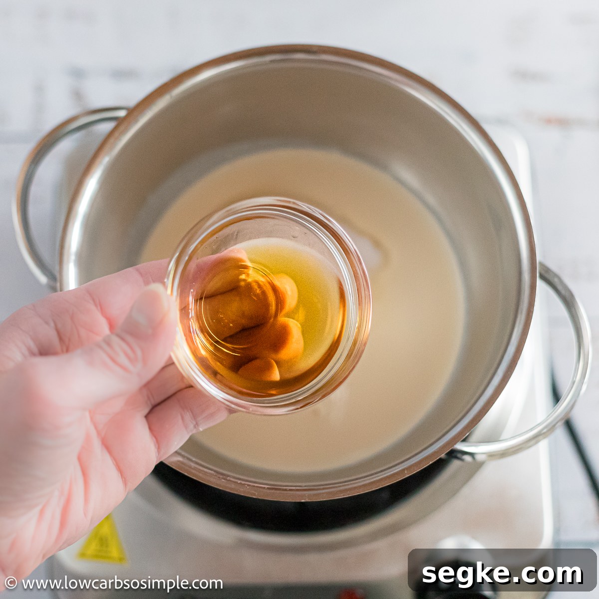 Keto Eggnog Gummies for Low-Carb Holiday Treats 4 Adding Dark Rum to Saucepan | Low-Carb, So Simple