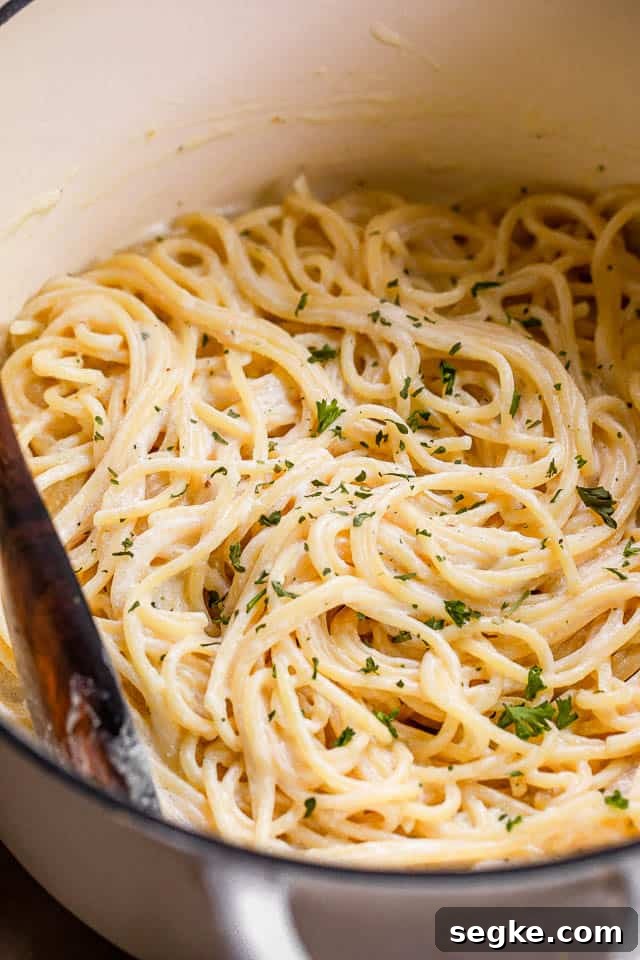 cooked spaghetti in a white dutch oven