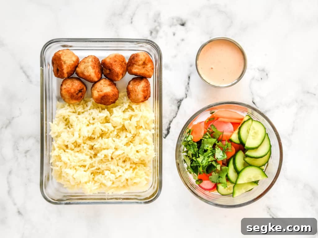 how to meal prep this meal in different containers for reheating: rice and meatballs in one container, veggies in another, sauce in a small container.