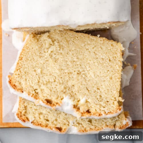 Slices of gluten free pound cake sitting on a cutting board.
