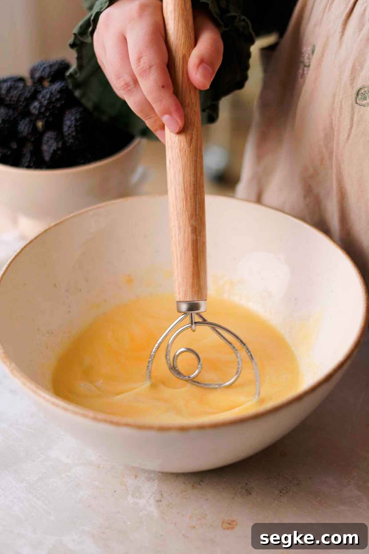 Blackberry Muffins Recipe: Fluffy, Juicy, Homemade 8 whisking wet ingredients for blackberry buttermilk muffins