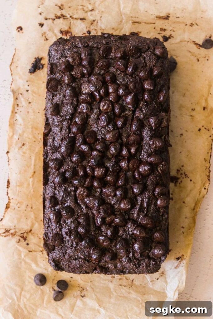 Gluten-Free Chocolate Zucchini Bread (Grain-Free Paleo Recipe) 4 Freshly baked chocolate bread loaf on parchment paper