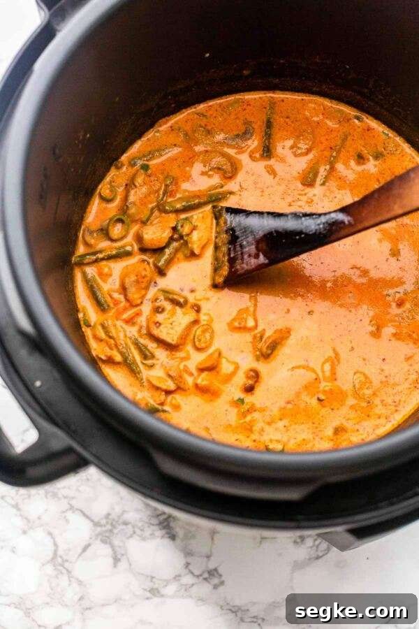 Thick and rich pressure cooker chicken curry with lots of vegetables. Quick and easy to make