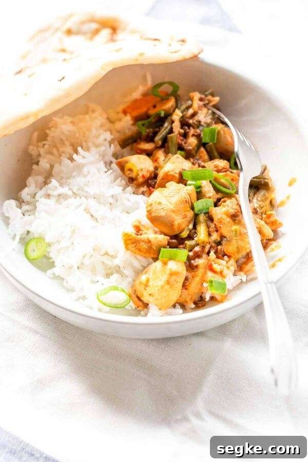 Tick and rich Instant Pot Chicken Curry made with coconut milk and lots of vegetables. Tasty to serve with a steaming bowl of rice or naan bread.