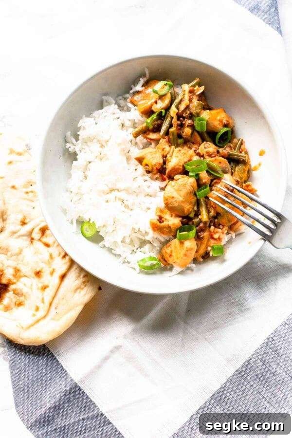 Chicken curry made in an Instant Pot with coconut milk and lots of vegetables. A great dinner dish to make ahead.