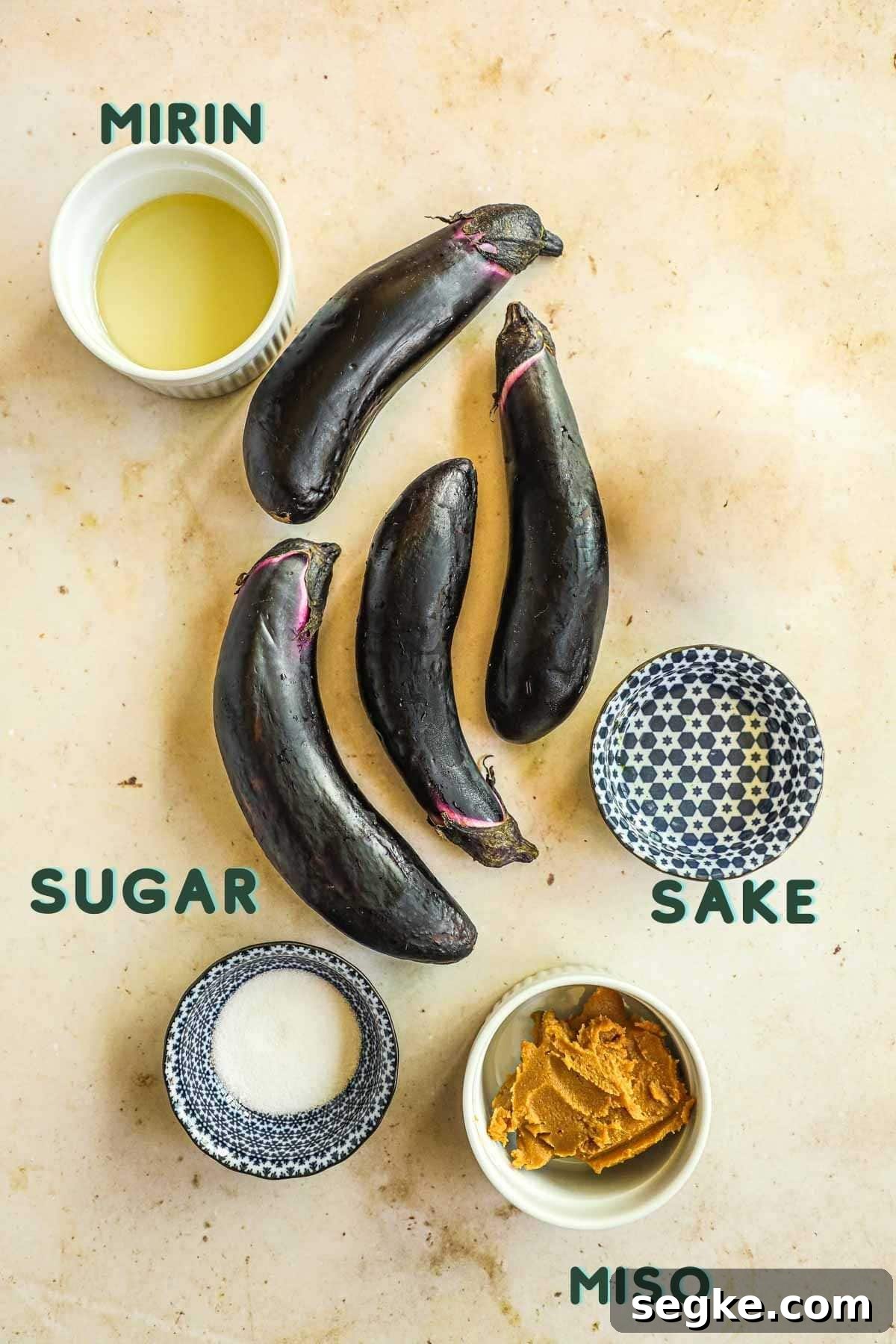 Ingredients to make miso sauce, including mirin, sugar, sake, and miso paste.