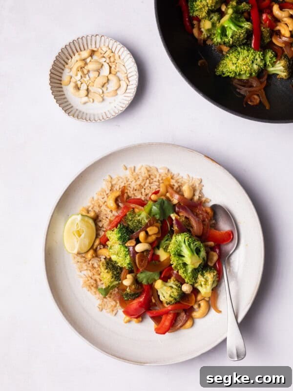 Broccoli Stir Fry served on a plate with brown rice.