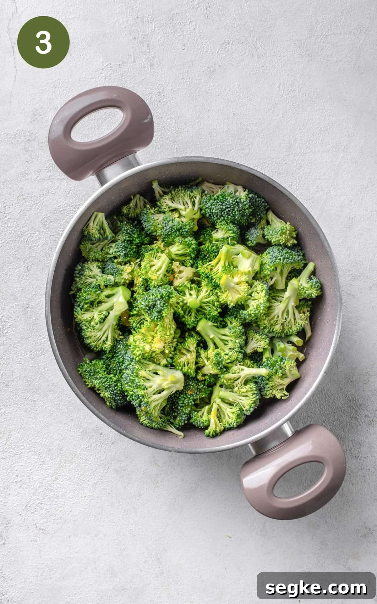 broccoli florets and celery stalks in a pot.