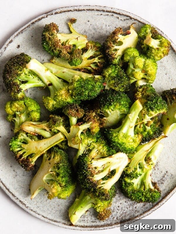 Air Fryer Broccoli on a grey plate.