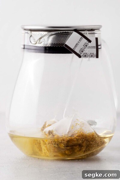Refreshing Chamomile Iced Tea with Honey and Lemon 5 Tea steeped in a teapot.