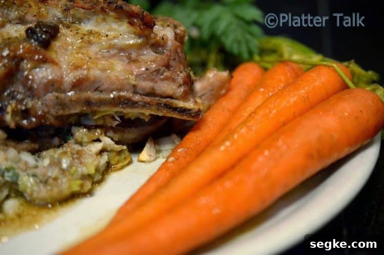 A plate with ribs and carrots.
