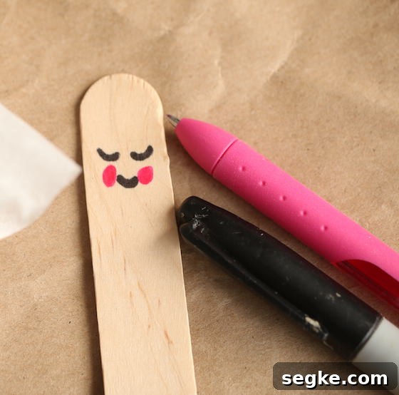 Angel face on popsicle stick