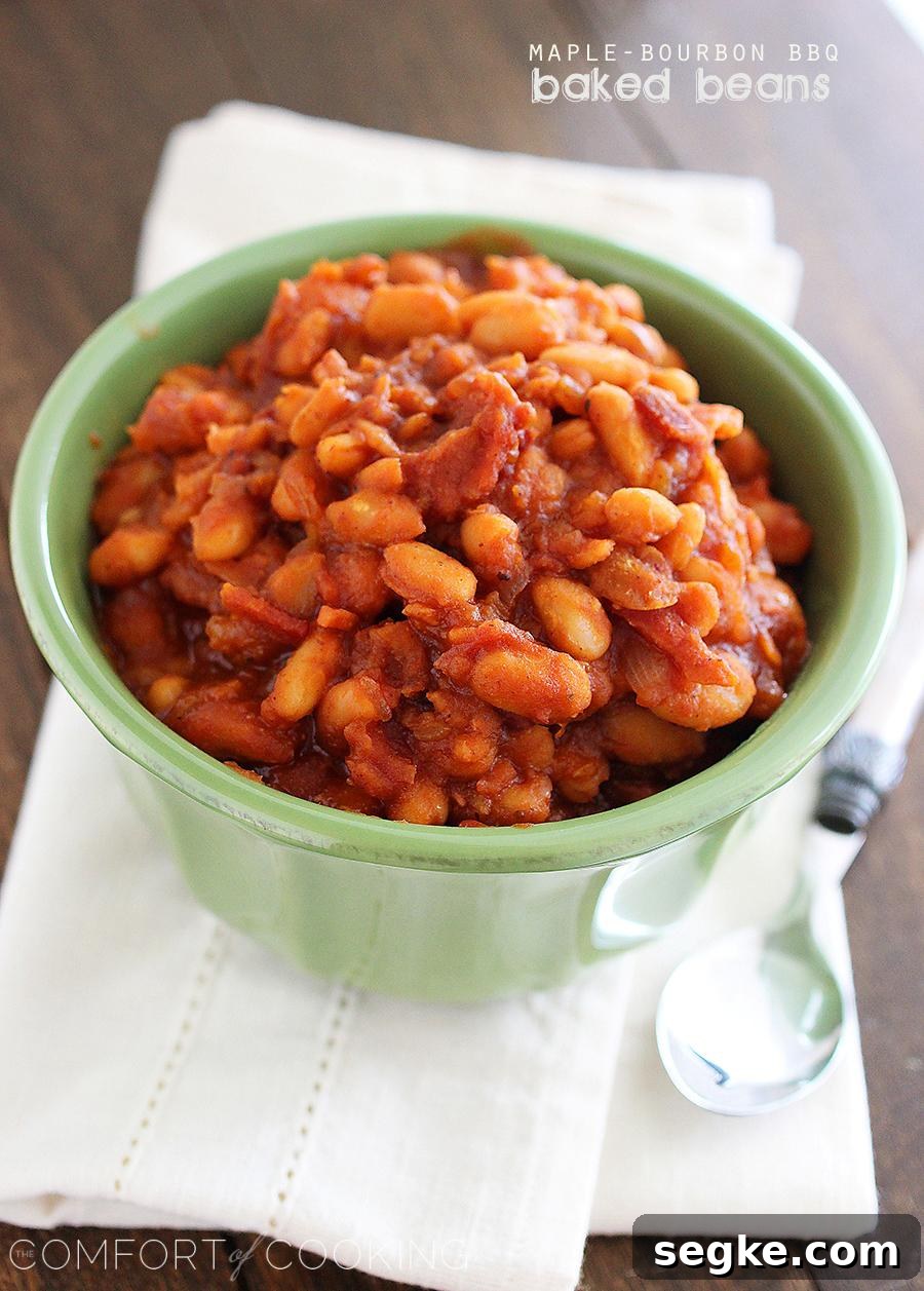 Easy Maple-Bourbon BBQ Baked Beans – These sweet, smoky 30-minute baked beans with bacon, bourbon and maple are the perfect addition to your BBQ plate!