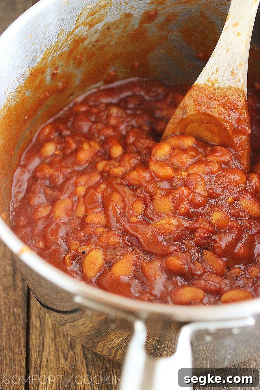 Easy Maple-Bourbon BBQ Baked Beans – These sweet, smoky 30-minute baked beans with bacon, bourbon and maple are the perfect addition to your BBQ plate!