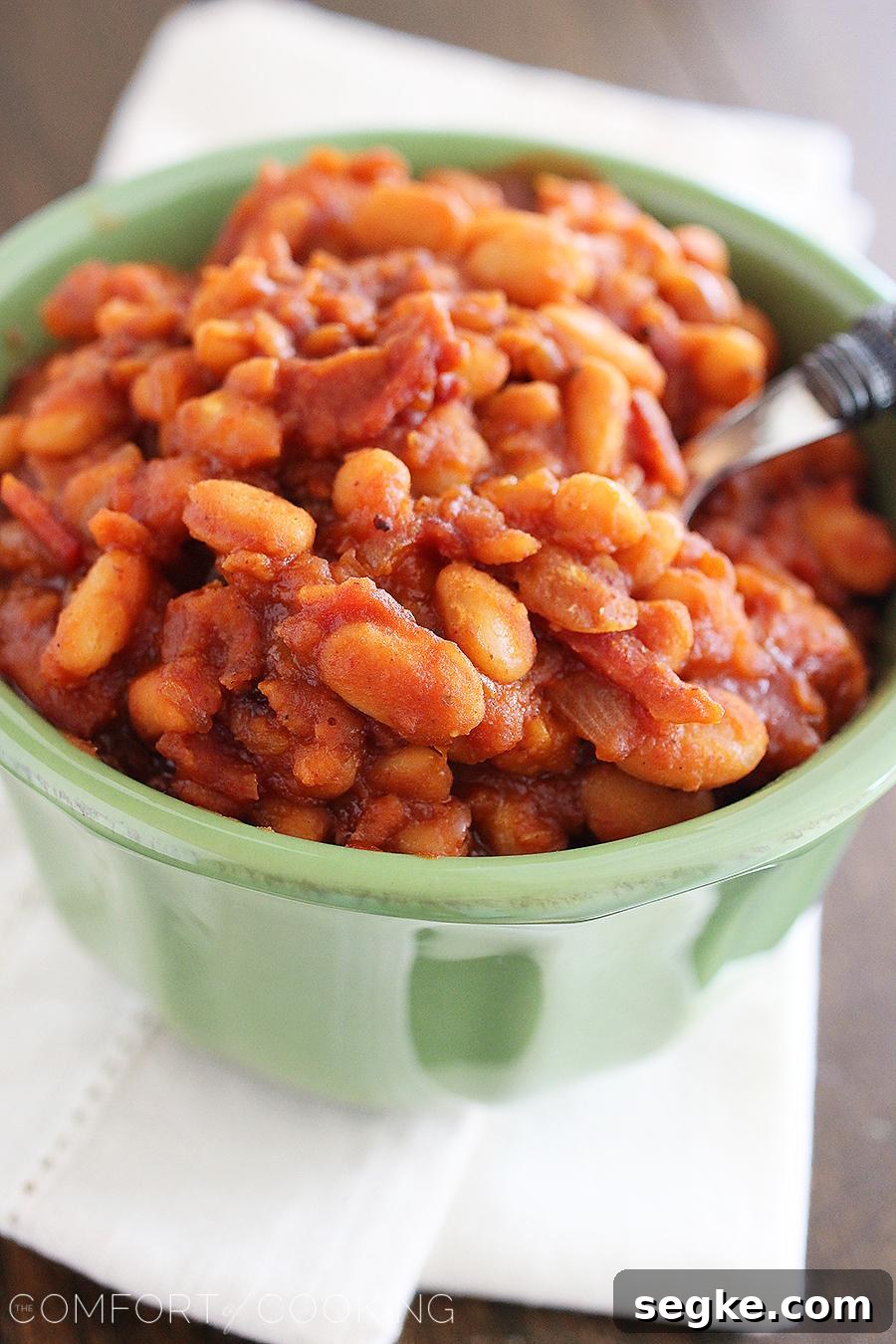 Easy Maple-Bourbon BBQ Baked Beans – These sweet, smoky 30-minute baked beans with bacon, bourbon and maple are the perfect addition to your BBQ plate!