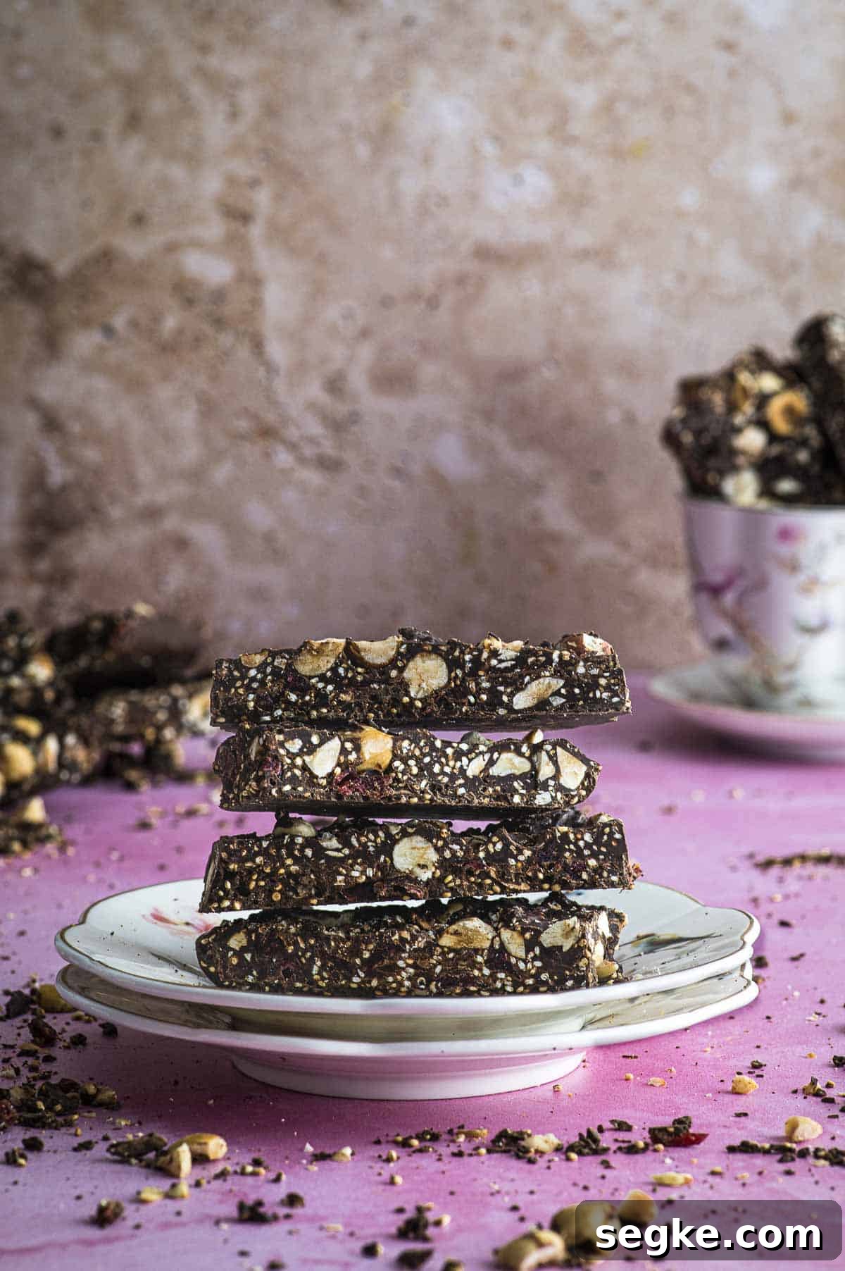Passover Crunchy Quinoa Chocolate Bars 2 Side view of a plate with piled passover quinoa crunch chocolate bars