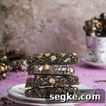Passover Crunchy Quinoa Chocolate Bars 6 Side view of a plate with piled passover quinoa crunch chocolate bars