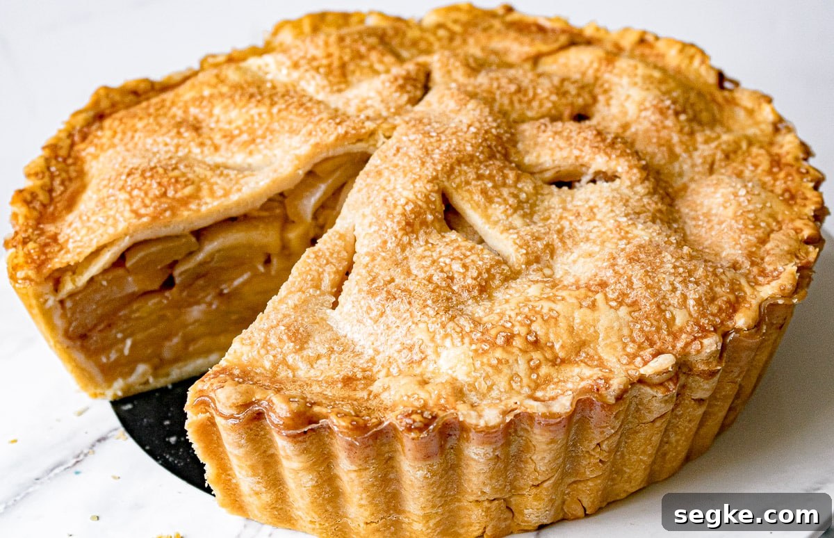 Caramel Apple Deep-Dish Pie Recipe 2 whole deep dish caramel apple pie with a slice cut out