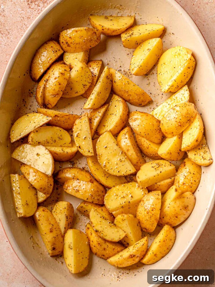 Potatoes in a pan before roasting.