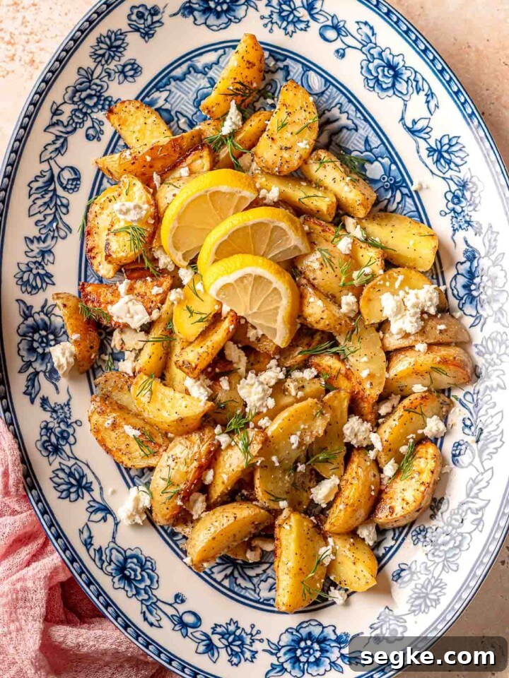 Blue platter topped with potatoes.
