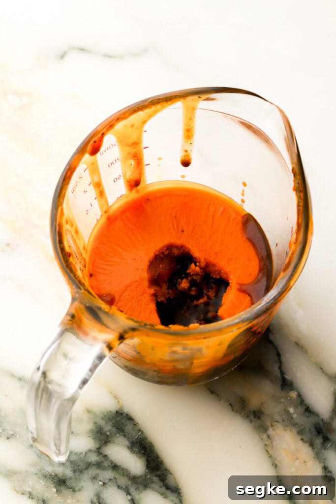 Everyday Braised Beef Recipe for Weeknight Dinners 11 chilled broth with the tallow risen to the top in a measuring cup