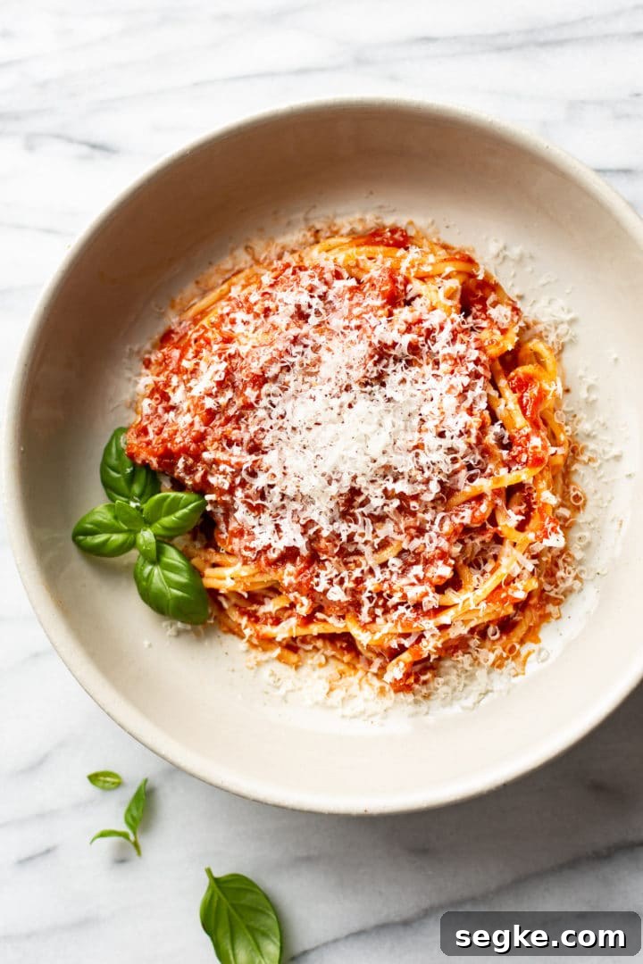 easy homemade marinara sauce over spaghetti in a shallow bowl