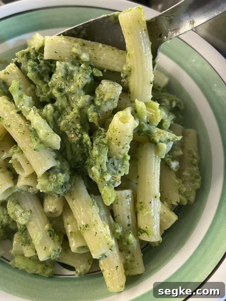 Lemony Broccoli Pasta with Pecorino 7 Finished Italian Broccoli Pasta being spooned into serving bowl.