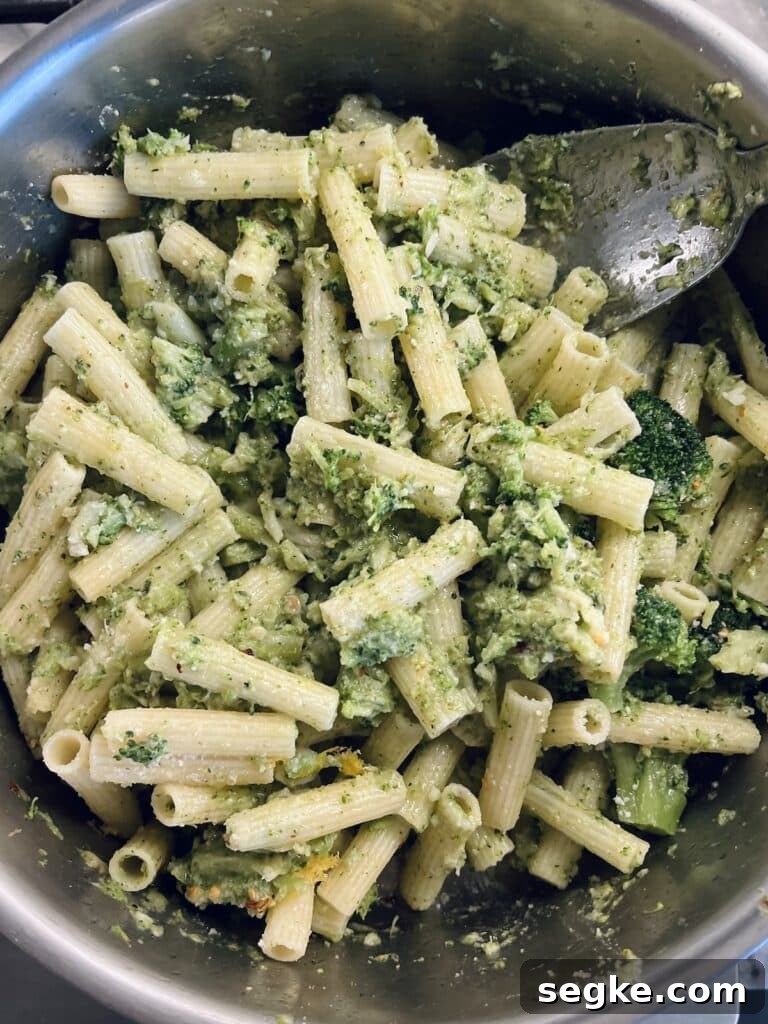 Lemony Broccoli Pasta with Pecorino 2 Italian Broccoli Pasta in pan with stainless steel spoon.