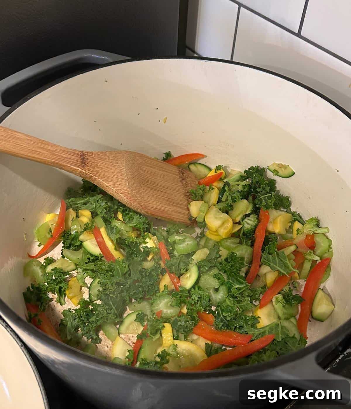 Vegetables sautéing in dutch oven.