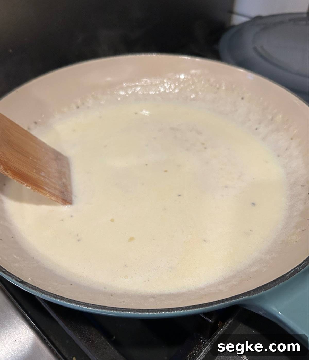 Creamy white sauce in skillet.