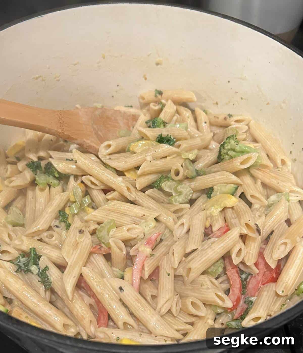 Creamy vegetable pasta in dutch oven.