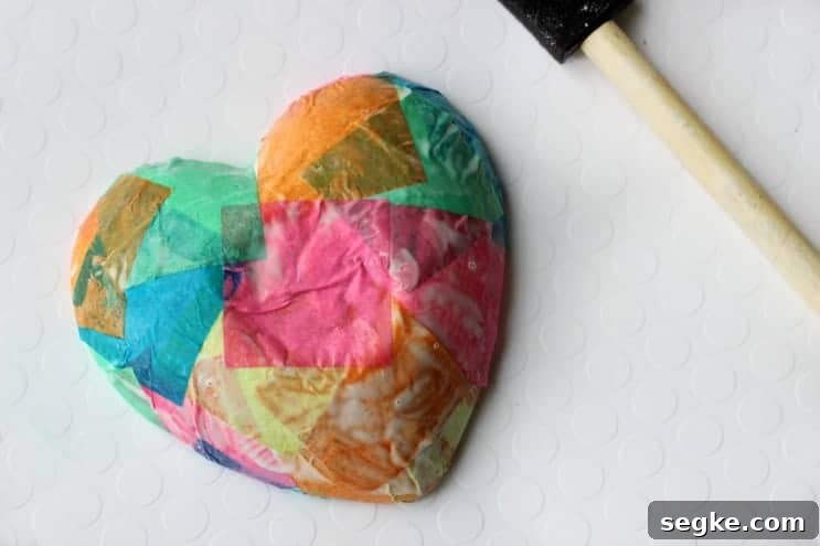 Add a bit of mod podge and tissue paper and completely transform this small bowl into a homemade jewelry dish! This technique also works on plates, jars, vases, and tile!